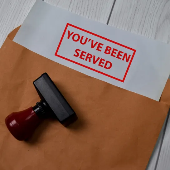 Process server documents with stamp saying you've been served